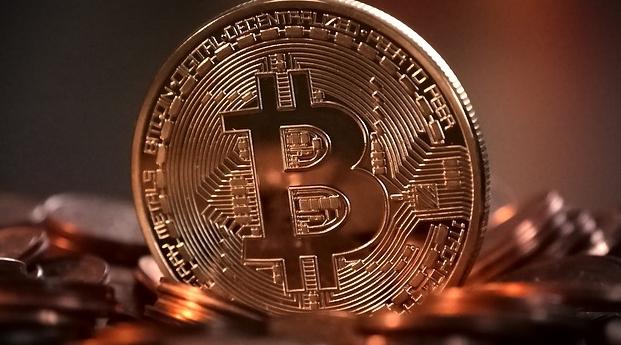 Cryptomonnaie : Le bitcoin franchit pour la première fois le seuil de 50.000 do…